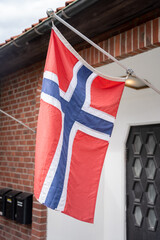 Norwegian flag in front of house