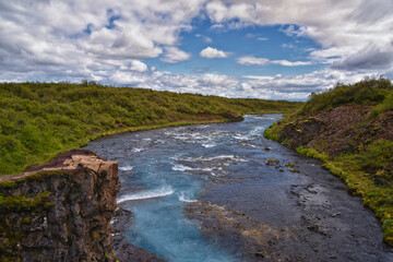 Bruarfoss or Bridge Falls, small hidden waterfall blue striking color, Iceland’s Bluest Waterfall, along Bruara river. Golden Circle South Iceland