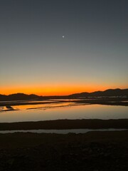 Fototapeta premium Beautiful sunset reflection over the sea at golden hour