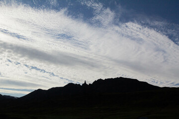 Silhouette of a striking mountain against a stunning sky filled with clouds, creating a dramatic and peaceful Icelandic scene