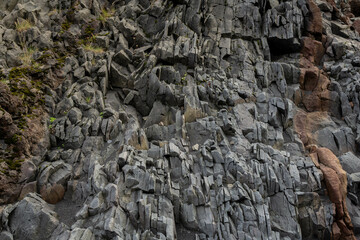 The textured surface of lava rocks on the black sands of Djúpalónssandur beach in Iceland