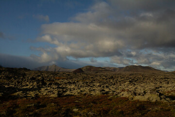 A scenic alley surrounded by numerous towering mountains in Iceland