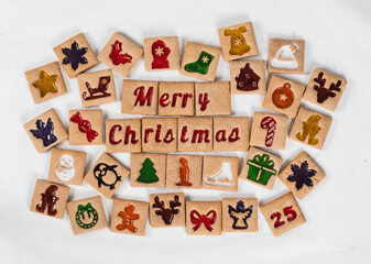 Merry Christmas. Ginger square cookies in a colored marmalade filling of a themed shape. White background. Top view	