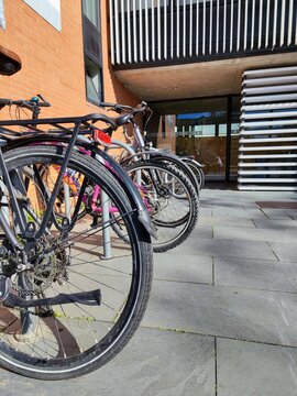 Urban Cycling: Bikes Parked Outside Modern Building