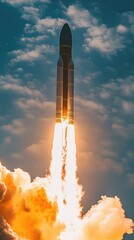 Spectacular Rocket Launching into Clear Blue Sky, Providing Thrilling View of Flames and Smoke, Showcasing Power of Modern Space Exploration Technology
