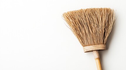 A Simple, Rustic Broom on a White Background