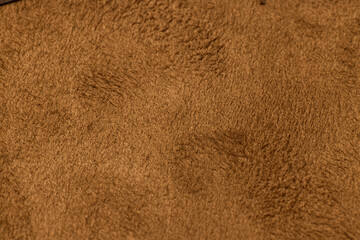 This luxurious Textured Suede Fabric comes in a rich Warm Brown Shade suitable for various uses