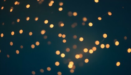Luces doradas borrosas sobre un fondo azul oscuro