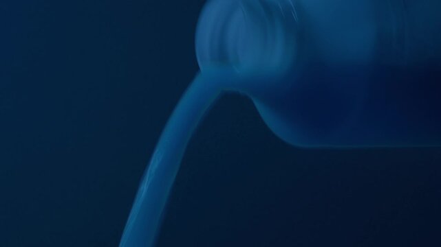 Bottle Poured Out In Dark Room Multiple Shots
