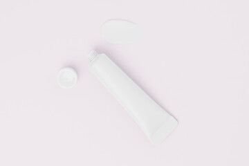 Open white mockup tube of cream and a smear on a pink isolated background. Concept of beauty products, spa, facial skin care, moisturizing, nutrition. Image for your design