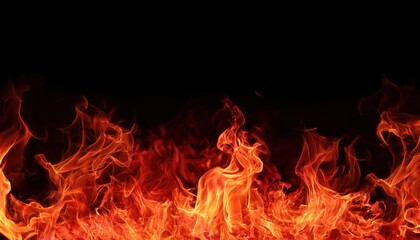 Fiery inferno blazes through the dark night, casting a warm, orange glow