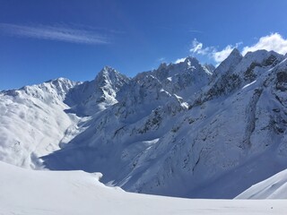 Mountain view with dark blue sky and a lot of snow