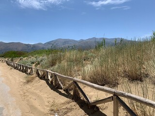 View at the mountains of Crete on a sandy beach walk