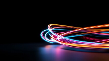 A colorful highway with neon lights. The lights are in different colors and are moving in a spiral.