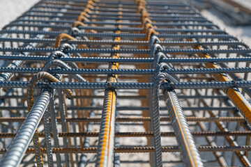 Iron rods tied to be placed in the foundation of a building.