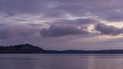 Serene Sunrise Over Vancouver Island Waters Under Purple Clouded Sky