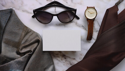 Business card mock up displayed among fashionable accessories for personal stylist branding