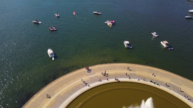 Experience the vibrant energy of Pittsburgh with this stunning aerial drone footage capturing the Point State Fountain on a crowded sunny day. The clip showcases the fountain in its full splendor.