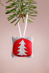 Handmade textile christmas ornament with chritmas tree
