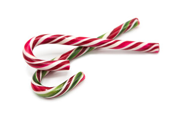 Classic glossy christmas candy cane lollipop isolated on white background. Kids festive sweets and treats. Symbol of gifts for the winter holidays.	