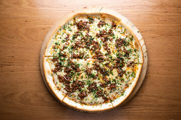 Bolognese Pizza loaded beef and topped with melted cheese served on wooden board isolated on table background top view of italian cousin
