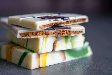 Piece of trend Dubai white chocolate with halva paste. Confectionery handmade sweets at home in the kitchen. 