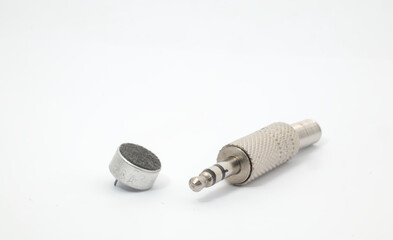 A 3.5 mm jack and a mini microphone on a white background. A standard connector used to connect electronic devices to audio devices. The 3.5 mm jack is also known as a mini jack, or aux jack.
