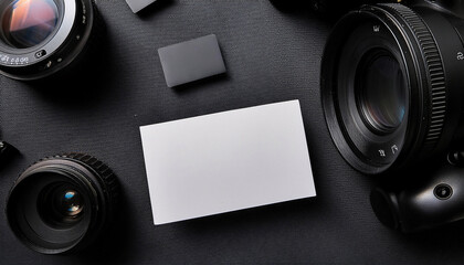 Creative business card mock up on a flat lay background with cameras and copy space for personalized branding design
