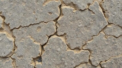 Obraz premium Close-up of a rough and weathered textured stone surface, pattern, macro