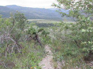 A beautiful view from the top of Serra do Cipó of a rain coming in the distance high in the mountains