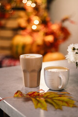 cup of coffee with autumn leaves