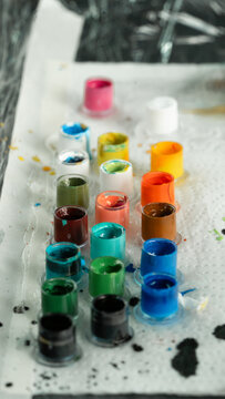 Colorful tattoo ink caps organized on a surface