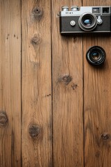 Fototapeta premium Vintage Camera and Lens on Rustic Wooden Surface