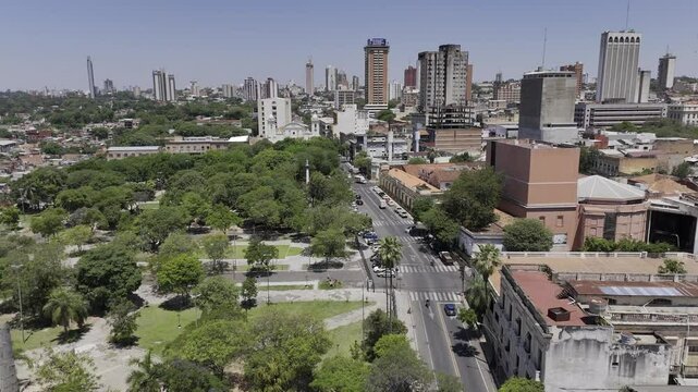 Drone flies east from Plaza de Armas over Catedral Metropolitana de Nuestra Se&ntilde;ora de la Asuncion in Asuncion, Paraguay