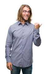 Young handsome business man with long hair over isolated background smiling with happy face looking and pointing to the side with thumb up.