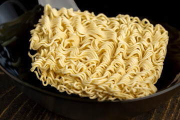 details of flour noodles with eggs during cooking