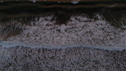 This amazing drone picture of the sunrise over the Black Sea in Romania captures the perfect moment when the first light of day touches the calm waters.