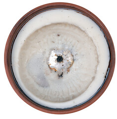 Burnt grave candles in clay containers on isolated background.