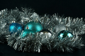 Blue and silver Christmas baubles with tinsel