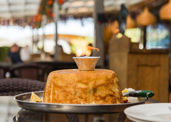 just cooked with a flame at the top of the Shah pilaf on the table in the restaurant