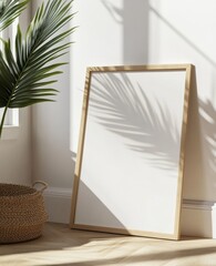 Empty blank white poster frame leaning against the wall