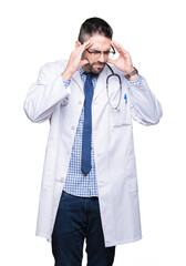 Handsome young doctor man over isolated background with hand on head for pain in head because stress. Suffering migraine.