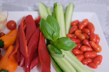 a piece of bell pepper to dip in sauce vegetables with sauce
