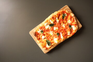 Indulge in a Delicious Rectangular Pizza topped with Fresh Ingredients and Flavors