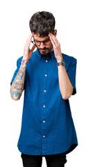 Young handsome man wearing glasses over isolated background with hand on head for pain in head because stress. Suffering migraine.