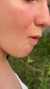 girl traveler bites fruit Wax Apple Java appale, wax apple , Syzygium samarangense fruits on tree. The fruit is also called Semarang rose-apple, and wax jambu.