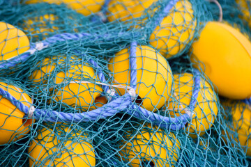 Fishing net with yellow and blue colors, closeup