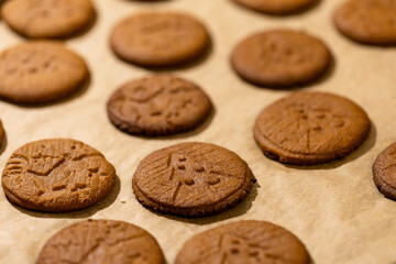 Oven tray with fresh hot gingerbread cookies, traditional Christmas recipe. aroma and taste of new year holidays