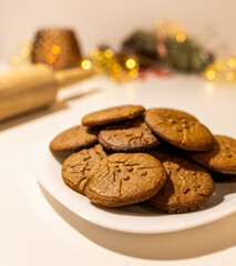 plate of fresh hot gingerbread cookies, traditional christmas recipe. aroma and taste of new year holidays