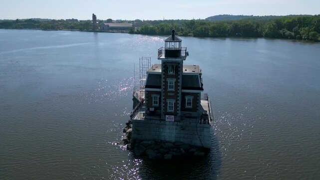 Historic New York lighthouse with mountains in the background, drone 4K